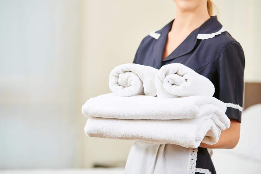 Maid with freshly laundered towels